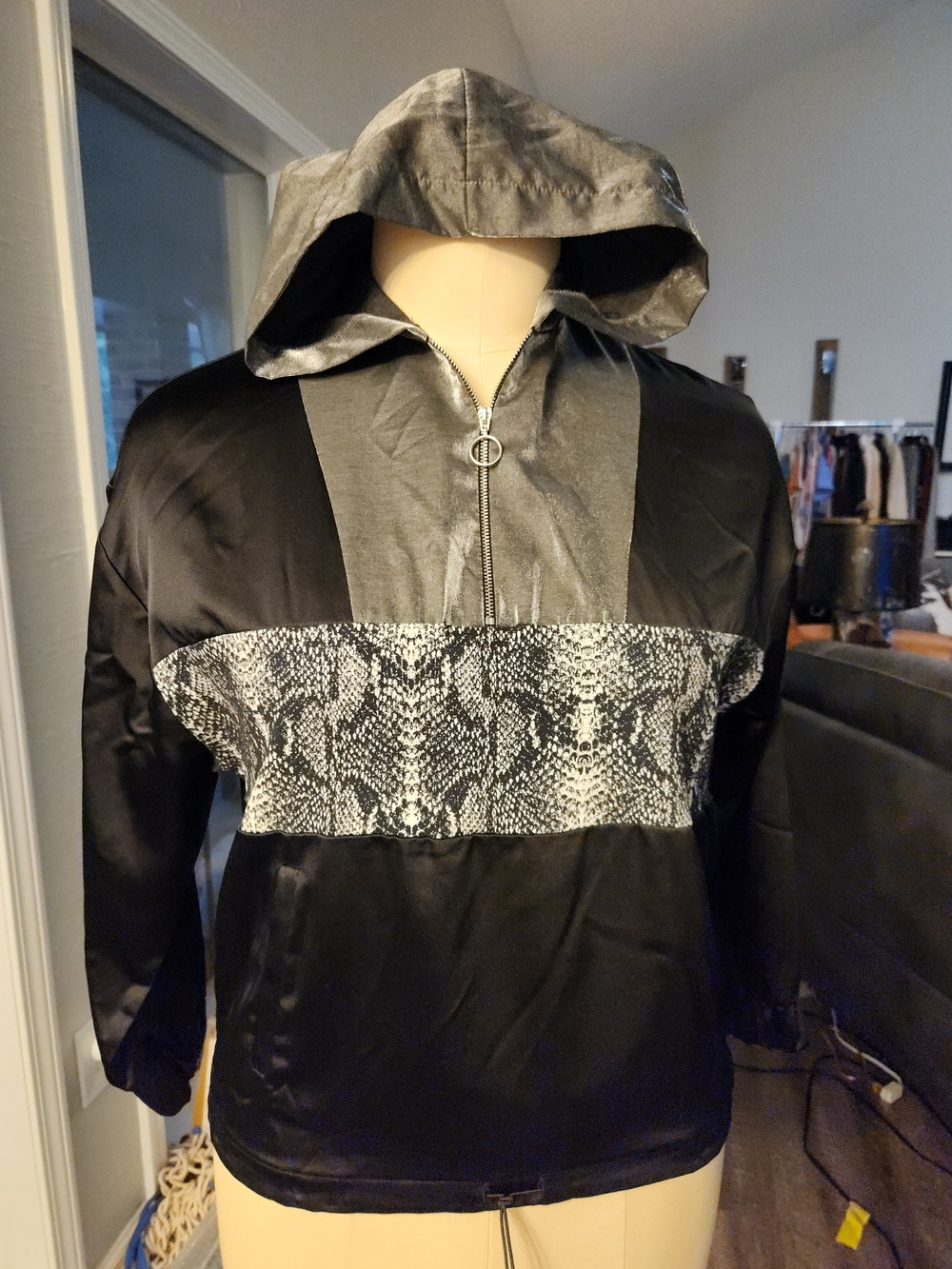 Zara Wimen's Black Hooded Windbreaker with Gray Snake-Print Panel